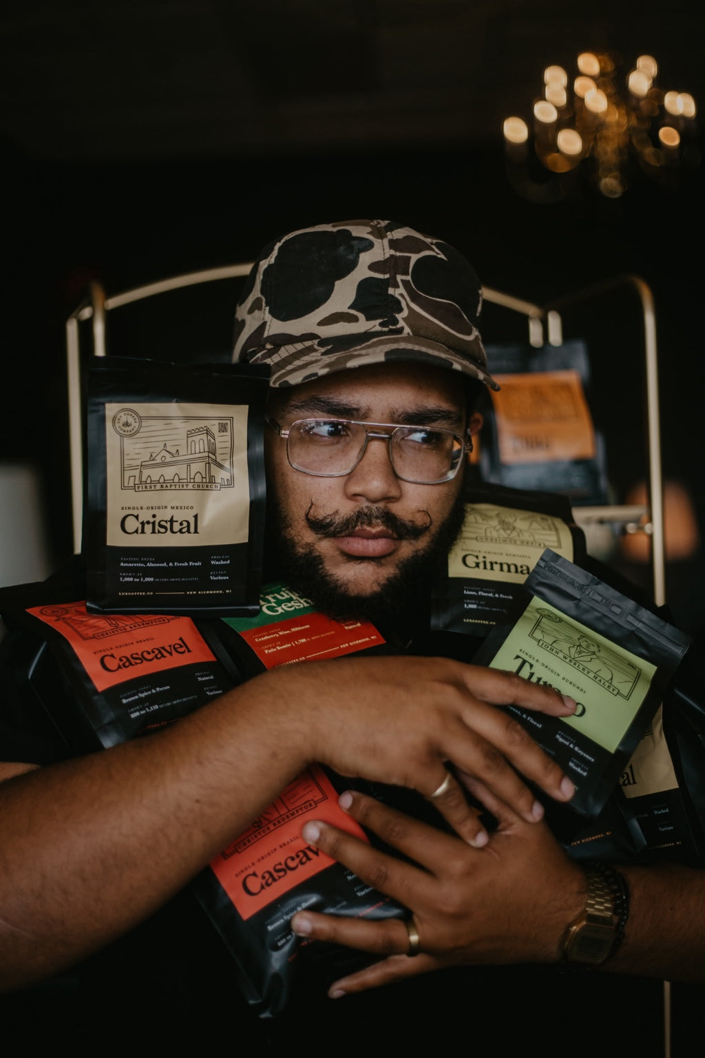The Lux roaster holding a selection of Lux coffee bags